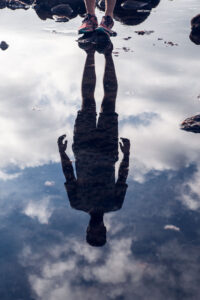 Man water reflection artistic photography Akris